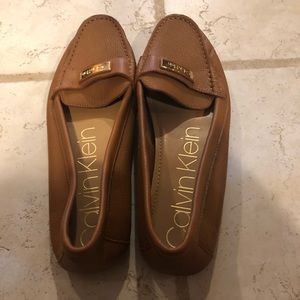 Calvin Klein slip ons.